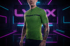 Person wearing a green and black wavy patterned cycling jersey