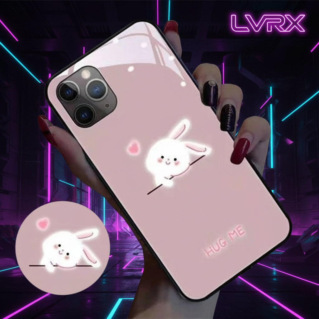 Phone case with a cute rabbit design and 'Hug Me' text, held by a person.