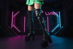 Black knee-high platform boots with buckles 