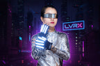 Person in futuristic outfit with glowing gloves against a dark background
