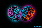 Two neon LED masks glowing in green and red on a dark background