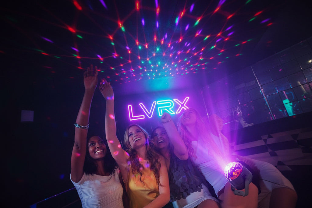 People enjoying a party with colorful disco lights