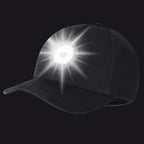 Black baseball cap with a built-in light on a white background