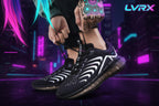 Person tying black and white running shoes on a pavement background