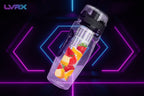 People exercising in a gym with a water bottle featuring fruit illustrations in the foreground.