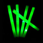 Green glow sticks on a black background